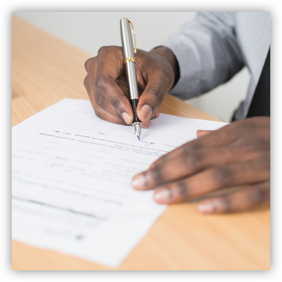 man signing contract with pen